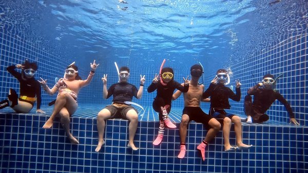 Freediver training calmly around reef and open water
