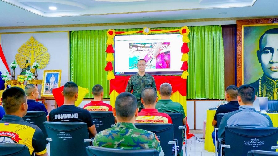 Instructor leading lifeguard classroom training for uniformed trainees