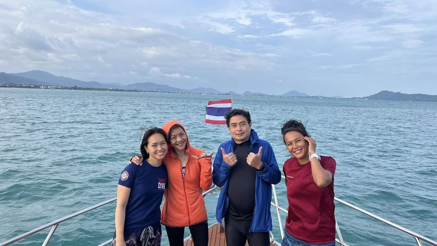 Super Dive Thailand guests and team smiling on a boat in Thailand