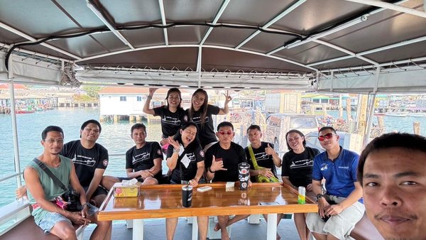 Dive group sharing a table on a local boat day